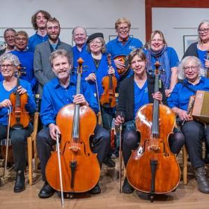 members of large band, all wearing blue shirts