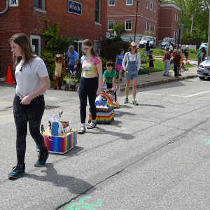 Birdget Matros, parade organizer, leads the procession. (photo by Erica Thoms)
