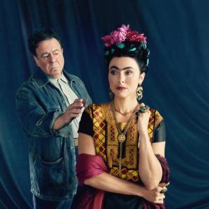 man in denim shirt, woman in costume