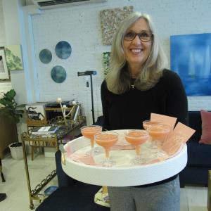 Ginger Mitchell, a family friend, serves the frosé (Photo by Kay Stephens)
