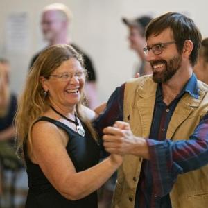 woman and man dancing together