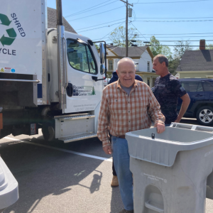man and shred bin