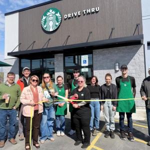 ribbon cutting in front of Starbucks