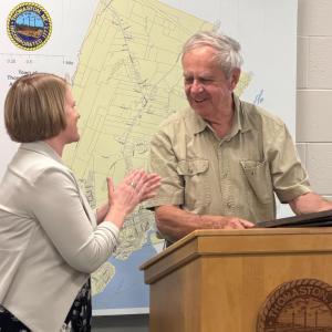 Bill was recognized during the Select Board meeting held on June 8, 2026. Pictured are Annual Report honoree Bill Hahn and Town Manager Kara George.
