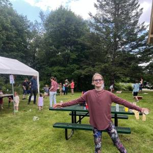 girl in front of picnic table