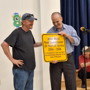 Town Administrator James Kossuth hands plaque to Amon Morse. (photo by Erica Thoms)
