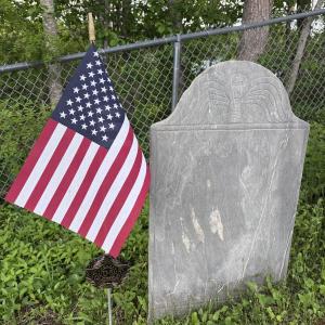 grave stone with American flag