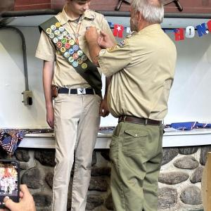 Scout receiving badge