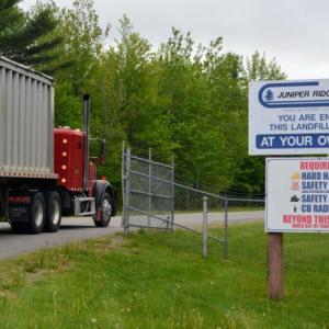 truck passing through gated entrance