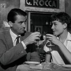 man woman have drinks at eatery