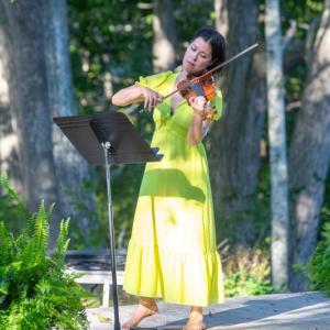 violinist in yellow dress