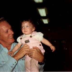 adult man holding toddler girl