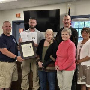 presenting framed copy of dedication