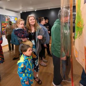 visitors view art displays