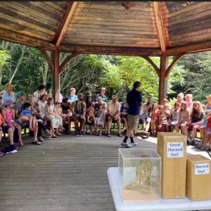 large group of people seated in gazebo