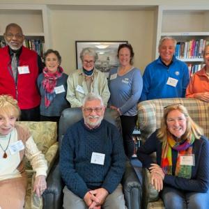 Nine adults pose for picture