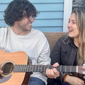 male and female with guitar