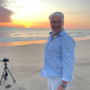 Man standing on a sandy beach