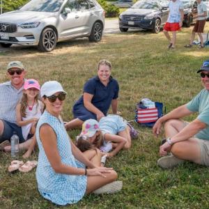 family sitting on lawn