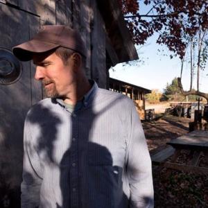 man standing in partial shade