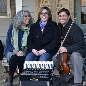 three adults pose for picture