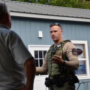 Maine Forest Ranger and Camden Fire Chief Chris Farley talk about the origin of the fire. (Photo by Lynda Clancy)