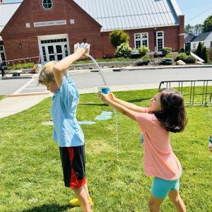 two children play a lawn game