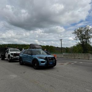 cruiser and white truck