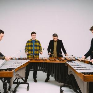 four men play xylophones 