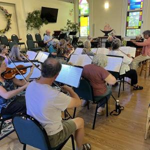string section in rehearsal