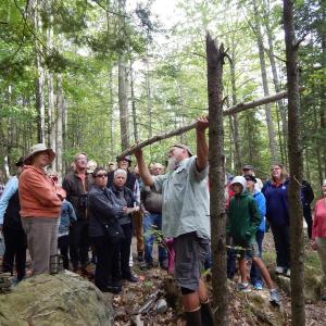 group listens to walk leadere