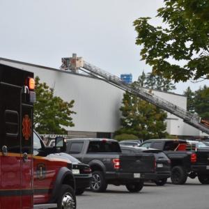 parking lot scene with ambulance, ladder truck