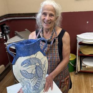 woman and ceramic urn