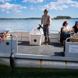 people ride in boat