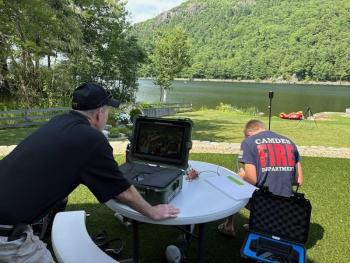 Camden firefighters Todd Anderson, Connor Howland and Bennett Cohen used the department's drone to assist with the search and rescue operation, setting up down the lake from the base Maiden's Cliff. (Photo courtesy Bennett Cohen) c